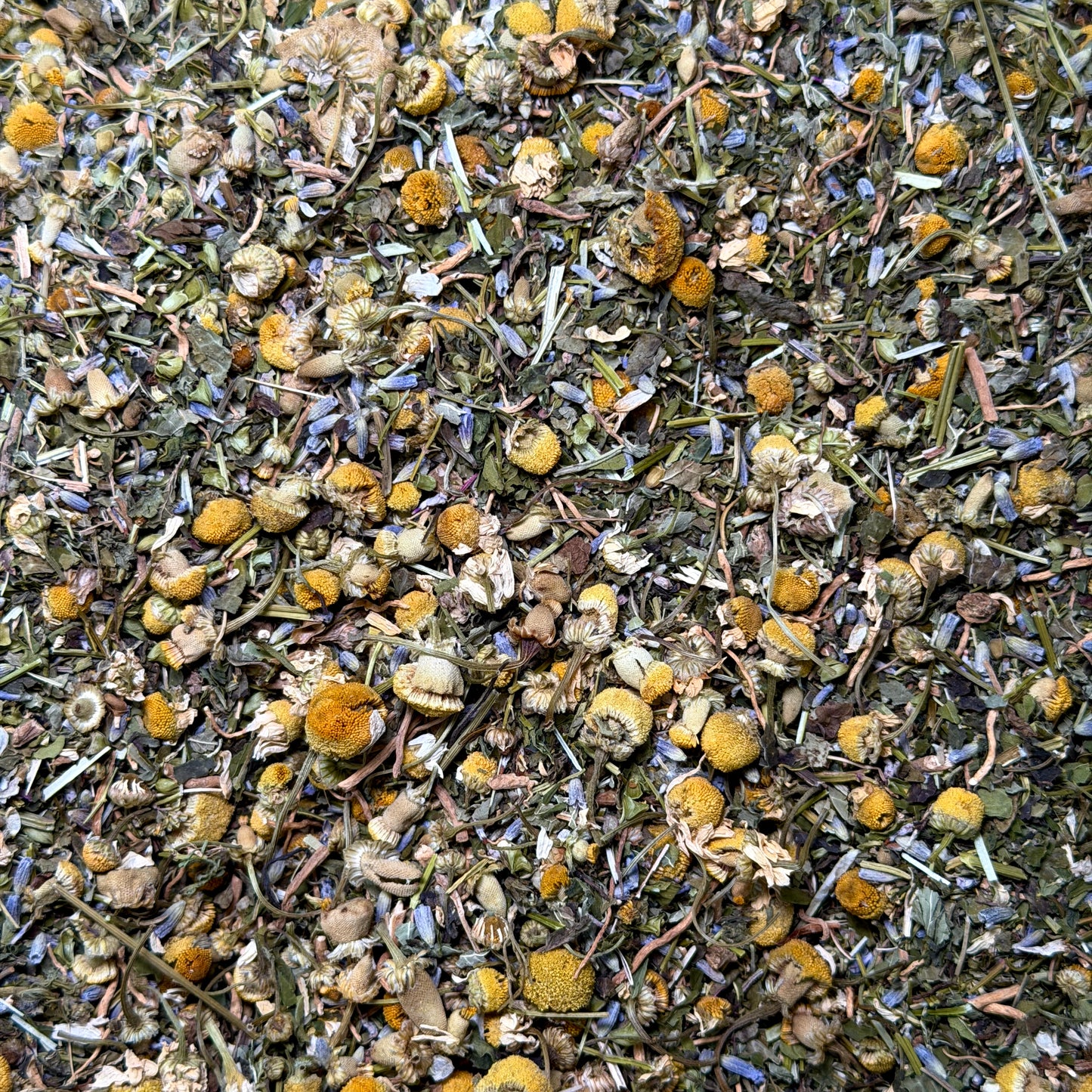 Dry herbs and flowers including chamomile and lavender.
