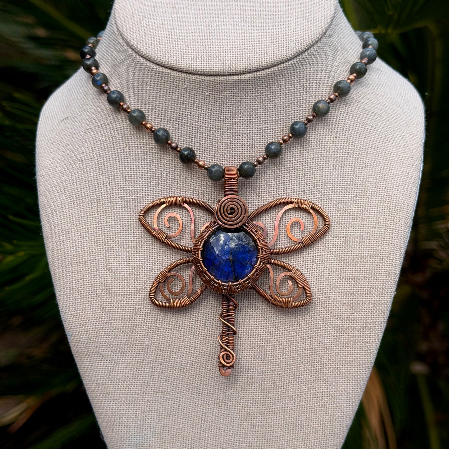 Beaded necklace with a dragonfly shaped pendant