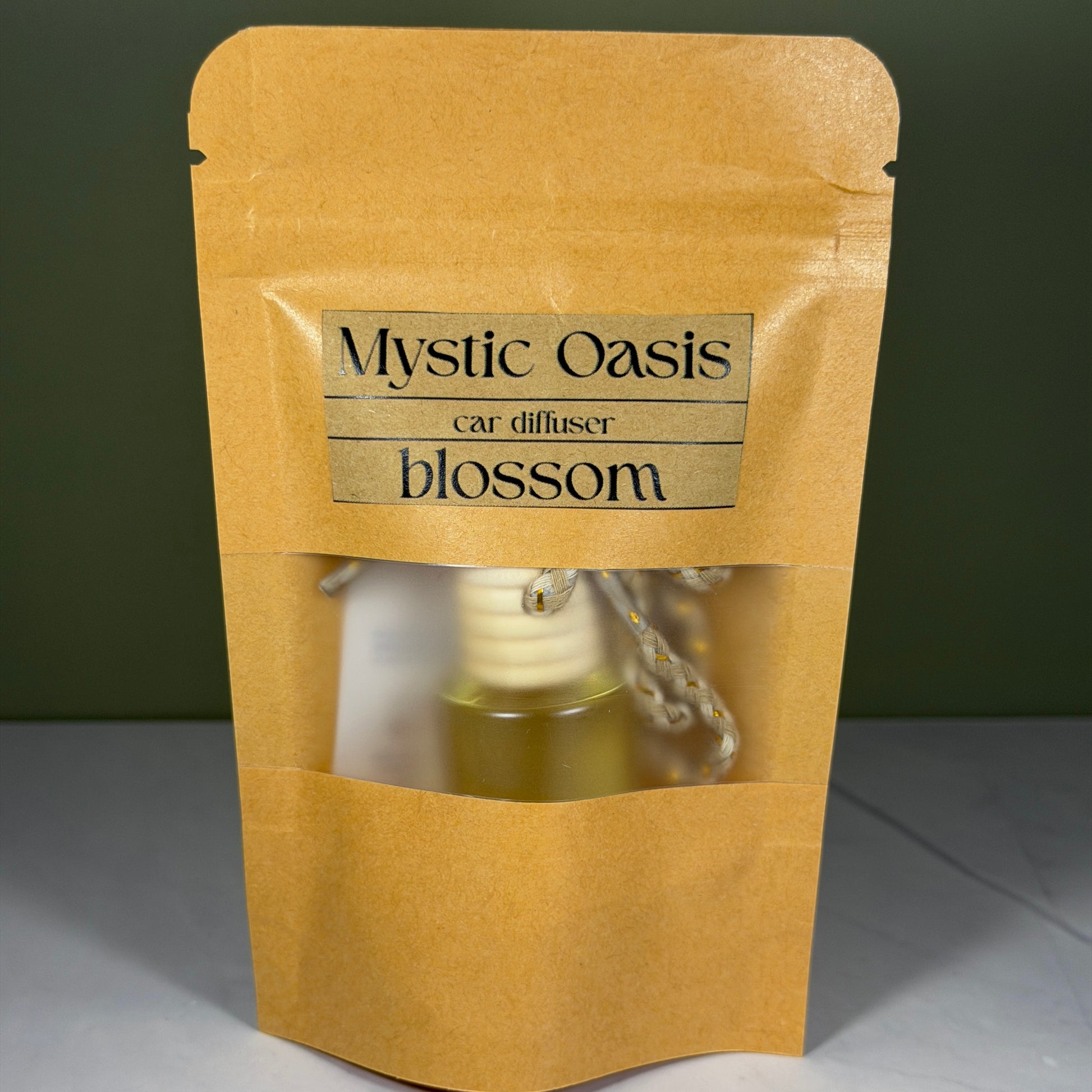 Mystic Oasis car diffuser blossom packaging on a gray background