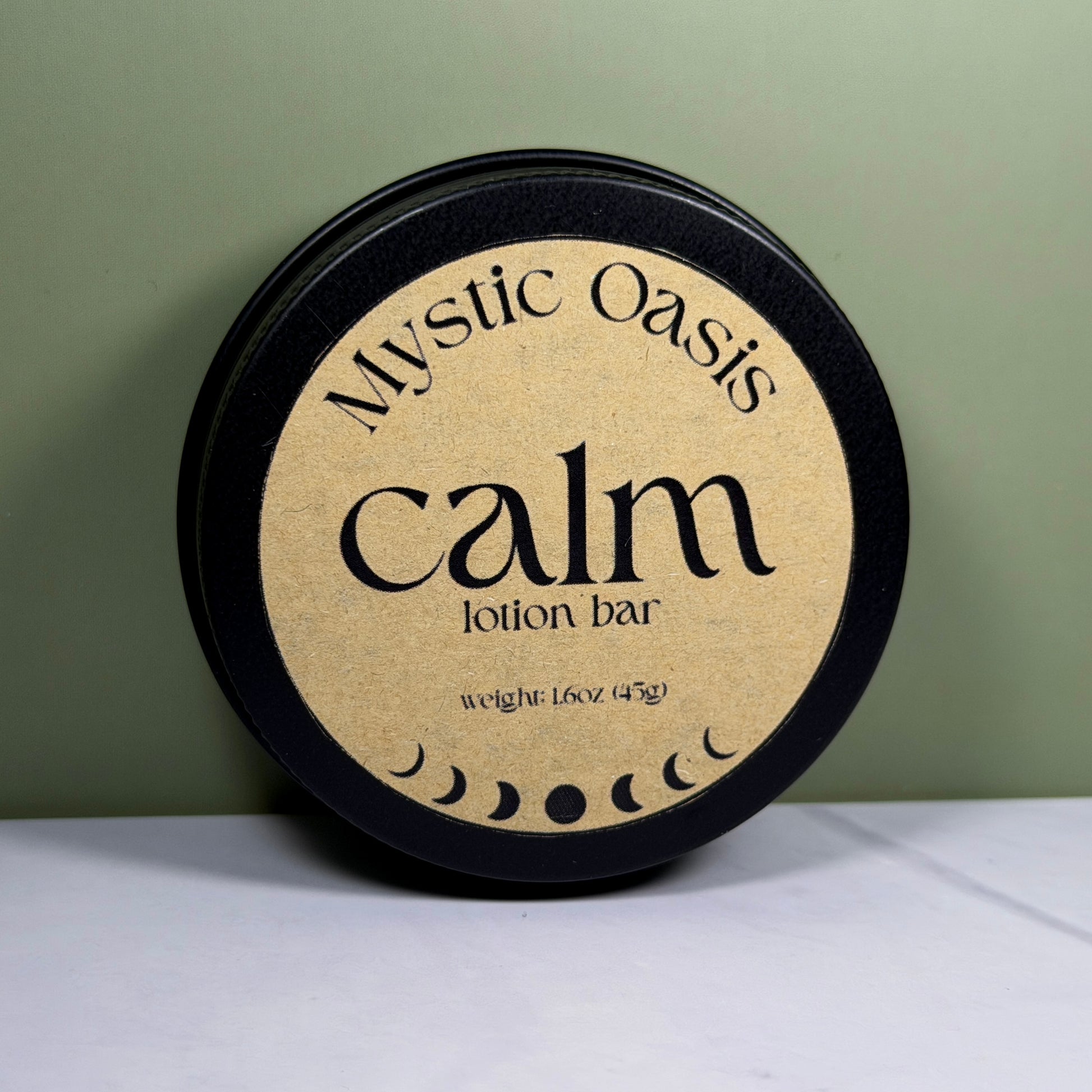 Mystic Oasis calm lotion bar packaging on a white surface with a green background