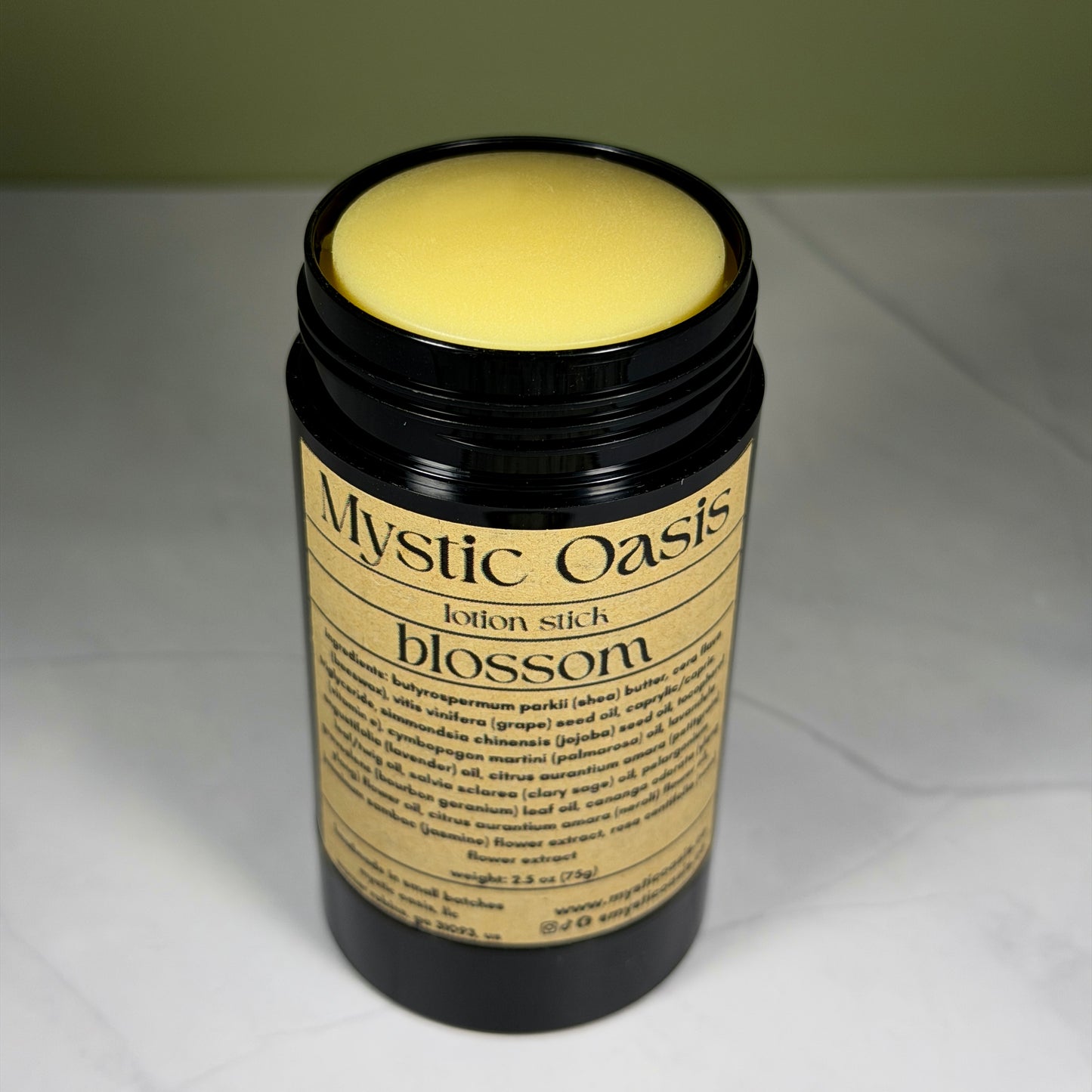 Mystic Oasis lotion stick labeled 'blossom' on a white background