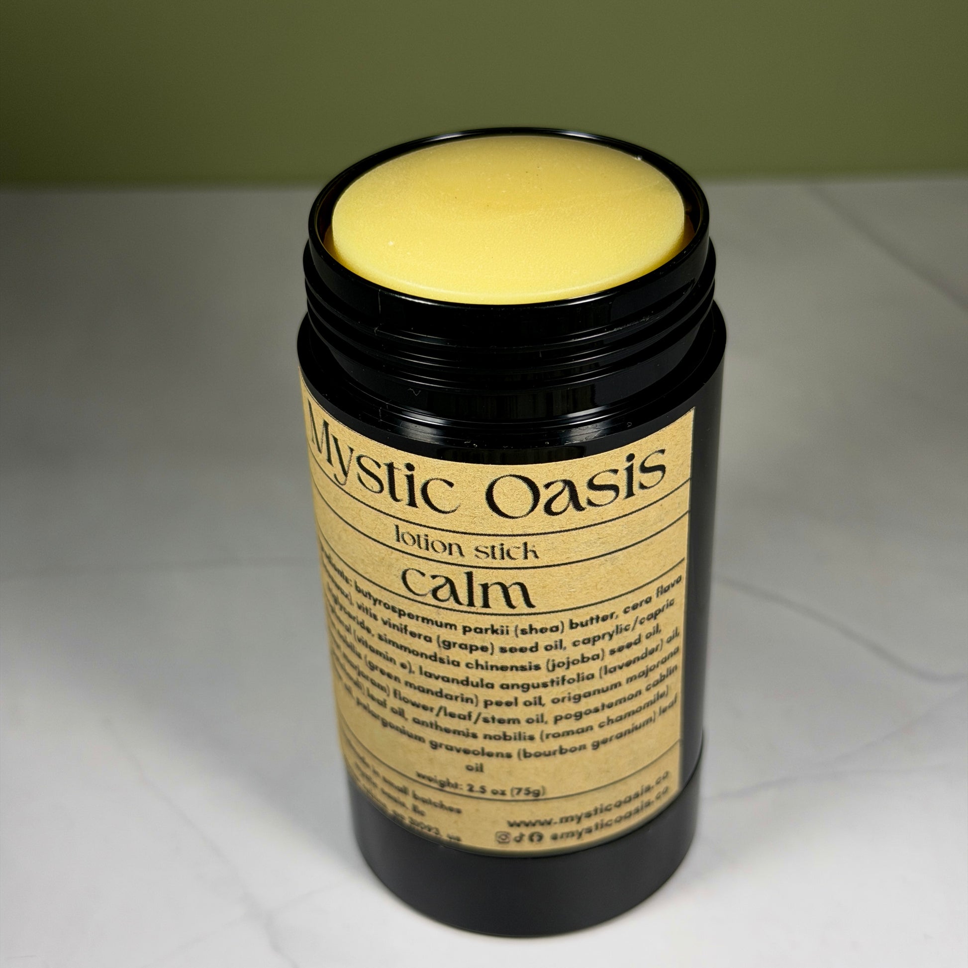 Mystic Oasis lotion stick labeled 'Calm' on a neutral background